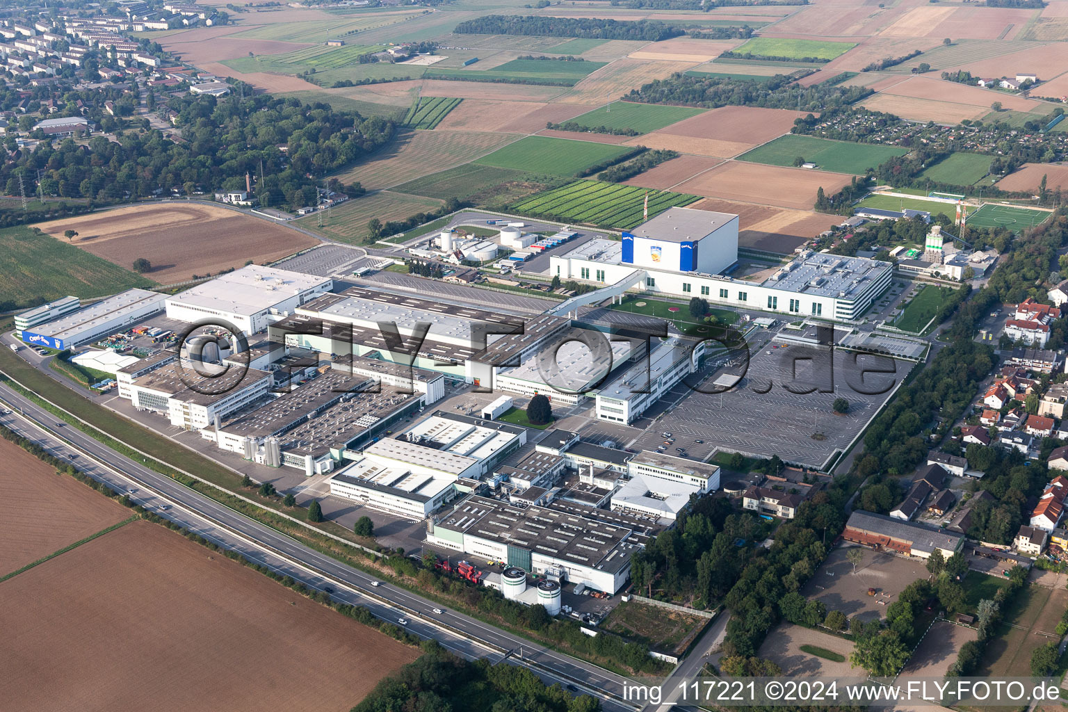 Building and production halls on the premises of Rudolf Wild GmbH & Co. KG (Capri-Sonne) in Eppelheim in the state Baden-Wurttemberg from above