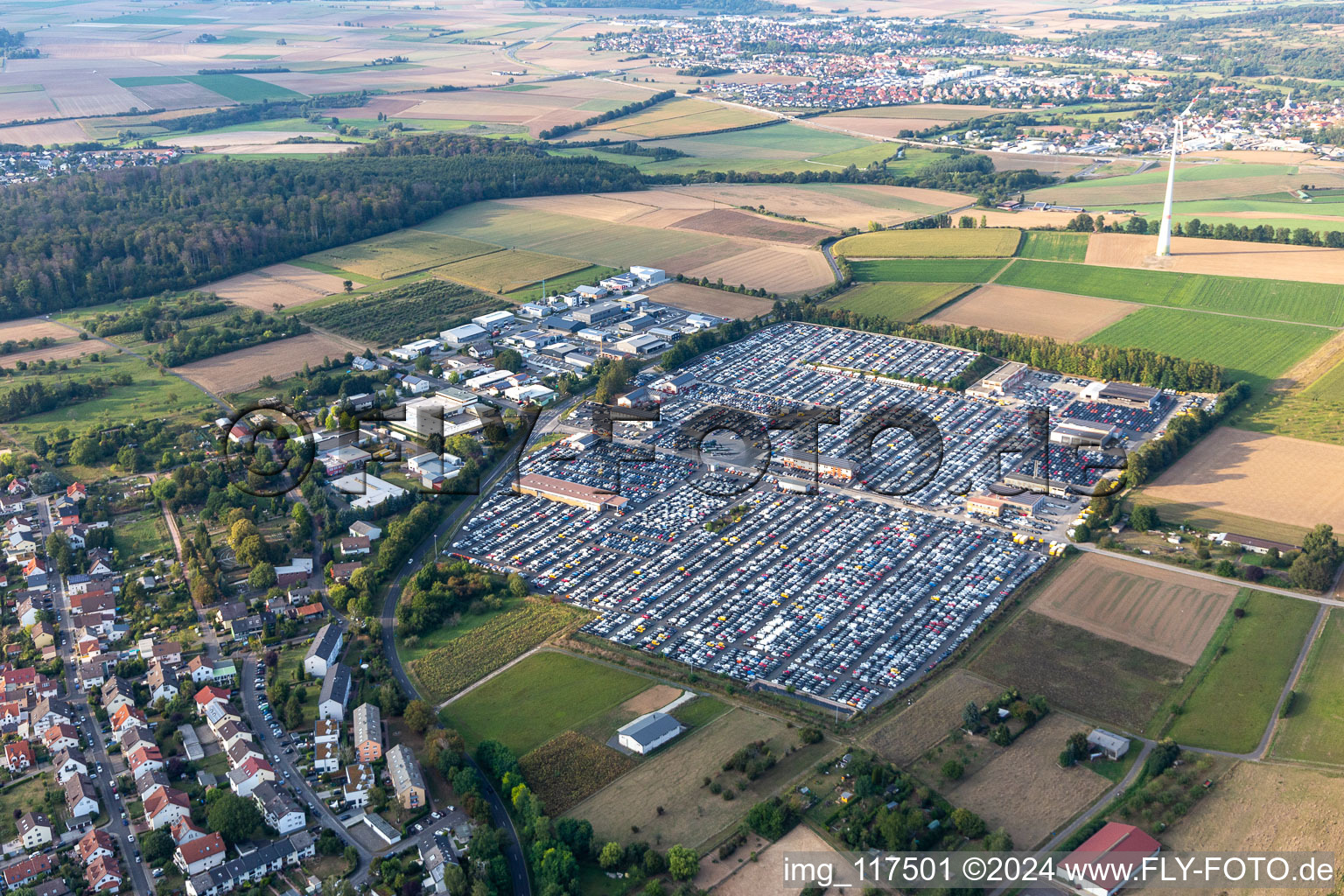 Aerial view of Parking and storage space for automobiles of AUTOKONTOR BAYERN GmbH in the district Kilianstaedten in Schoeneck in the state Hesse, Germany