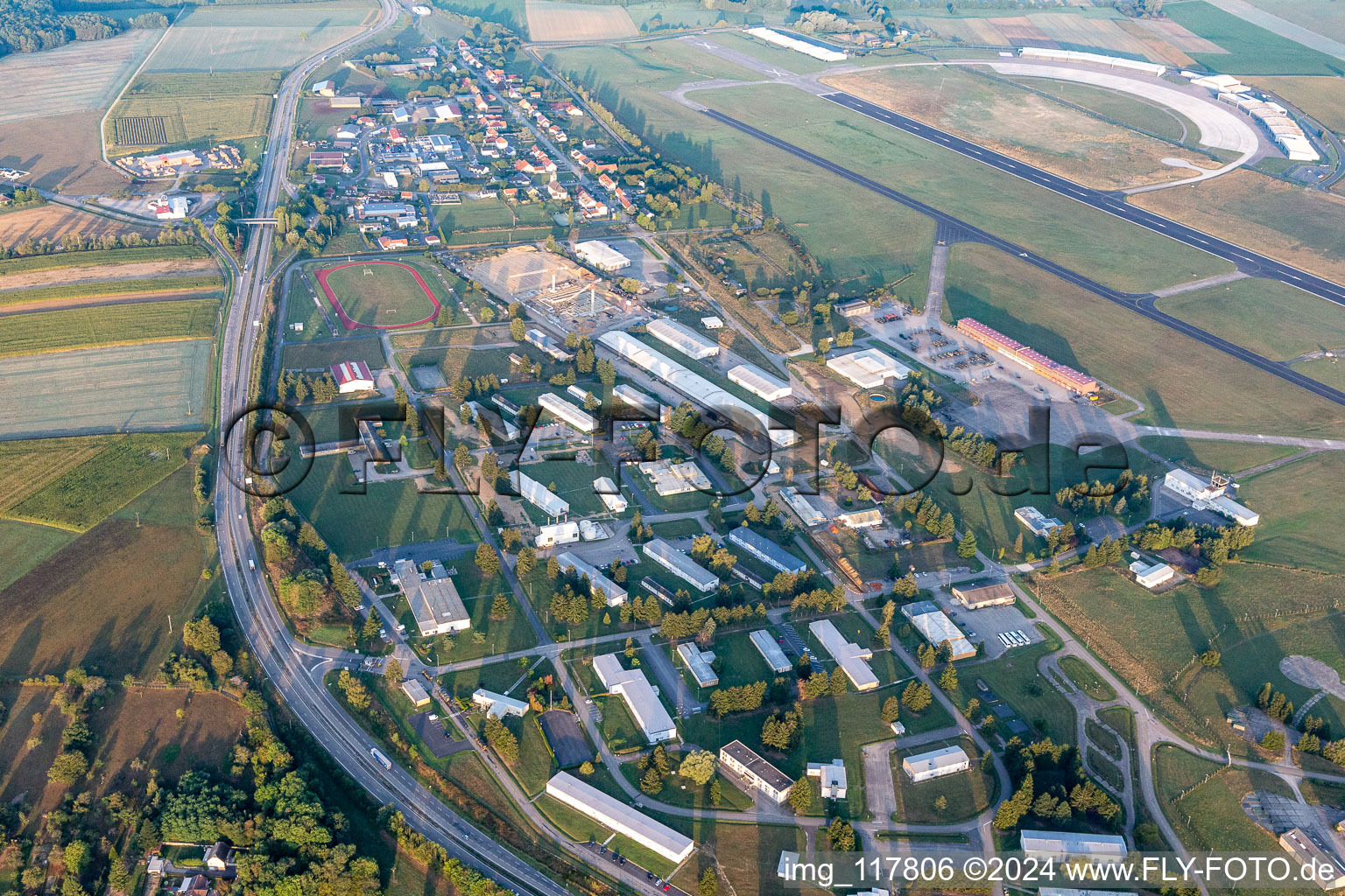 Buildings and runway with tarmac of the Phalsbourg-Bourscheid military airfield "Camp LA Horie" in Saint-Jean-Kourtzerode in Grand Est, France