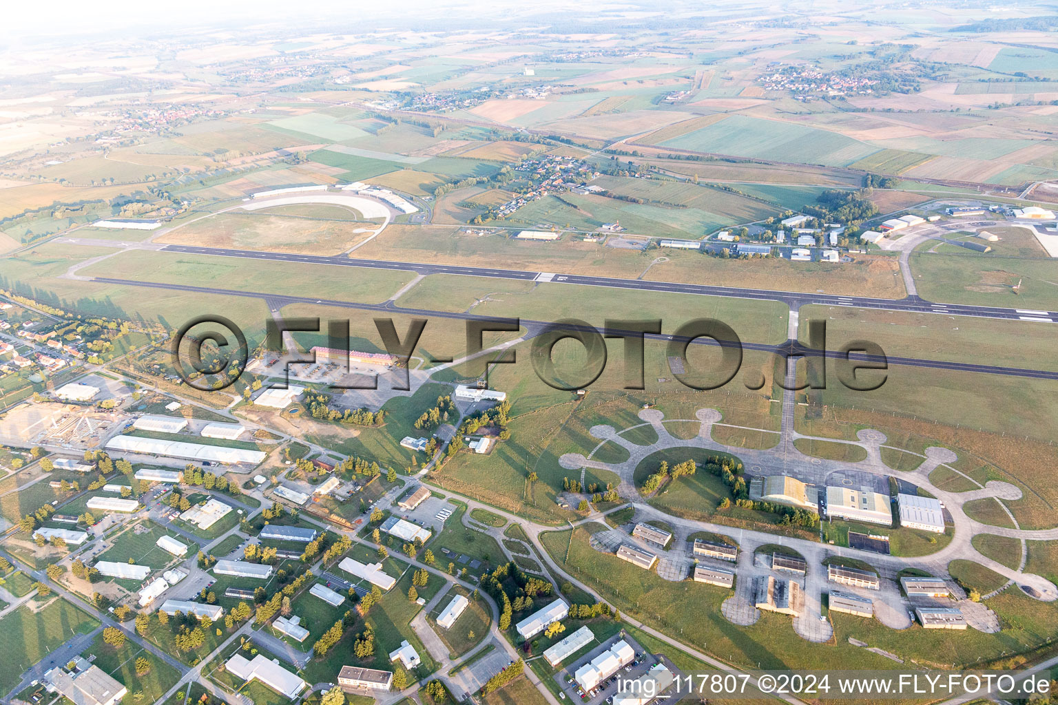 Aerial view of Buildings and runway with tarmac of the Phalsbourg-Bourscheid military airfield "Camp LA Horie" in Saint-Jean-Kourtzerode in Grand Est, France