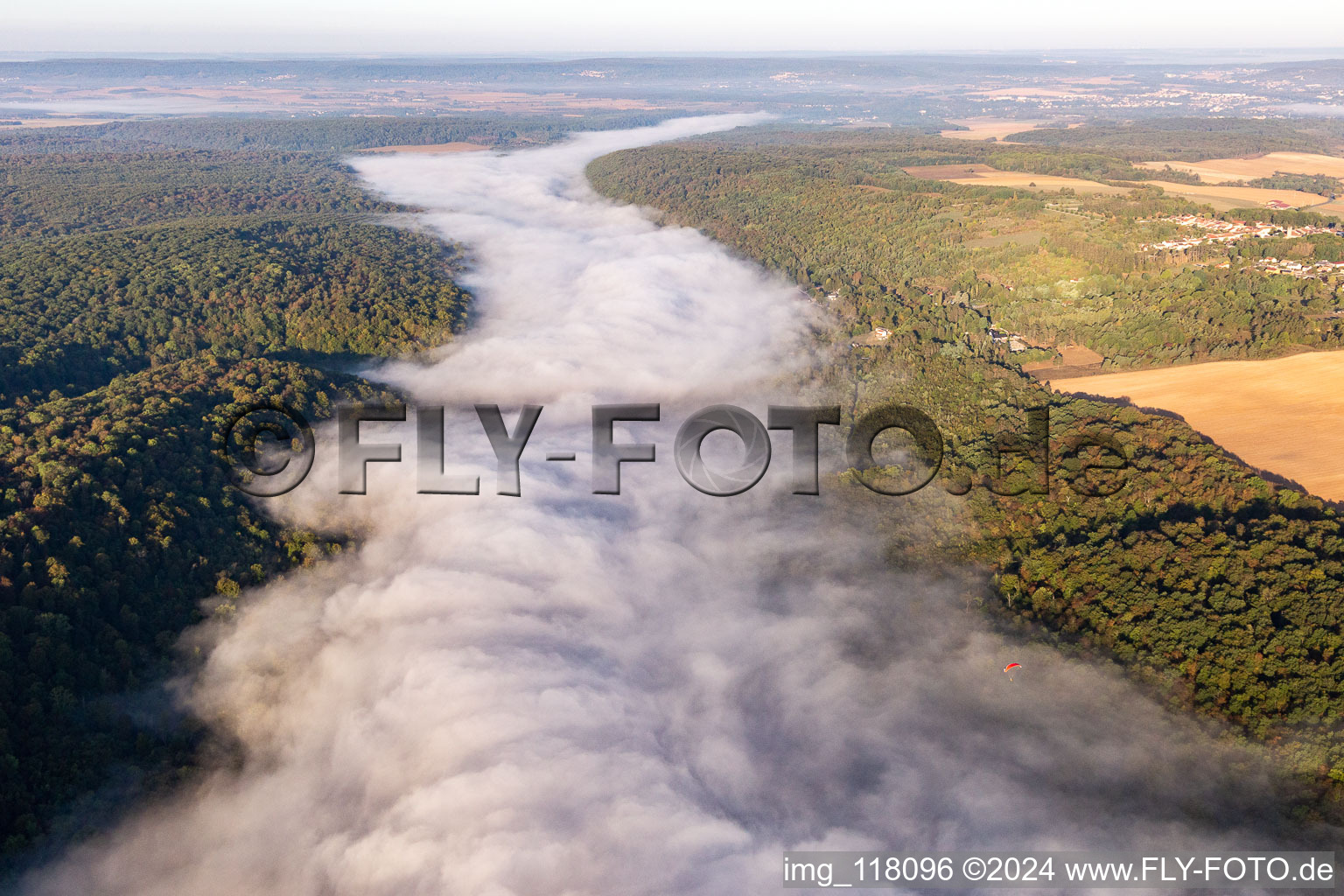 Riparian zones with fog clouds on the course of the river of the river Mosel in Maron in Grand Est, France