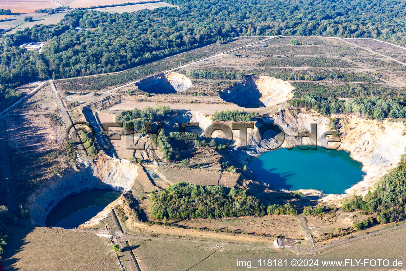 Landslide hole in the shape of a crater filled up with groundwater in Lenoncourt in Grand Est, France