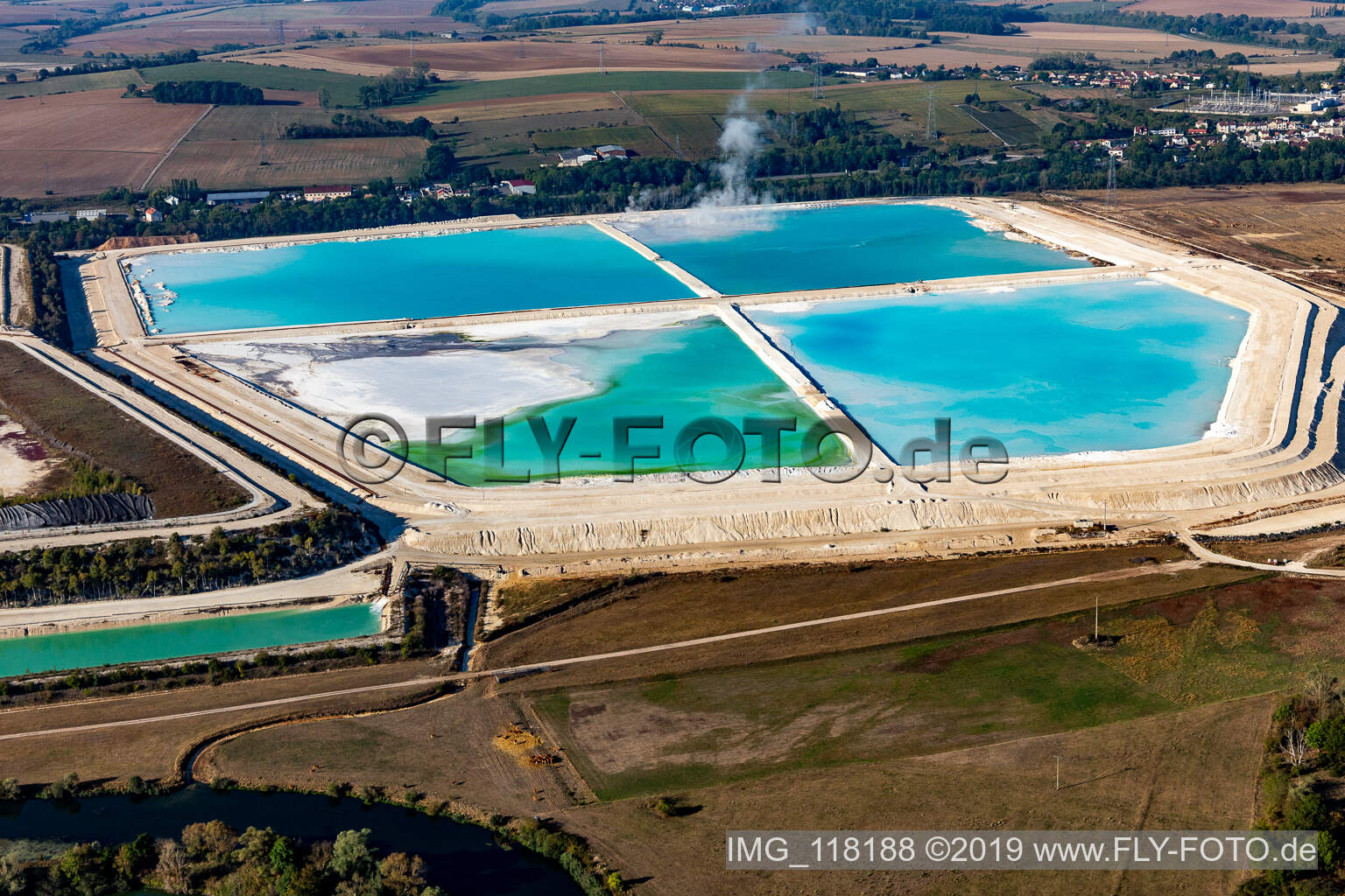 Turquoise-blue saltworks for the potash extraction of the Compagnie des Salins du Midi et des Salines de l'Est SA in Laneuveville-devant-Nancy in Grand Est, France