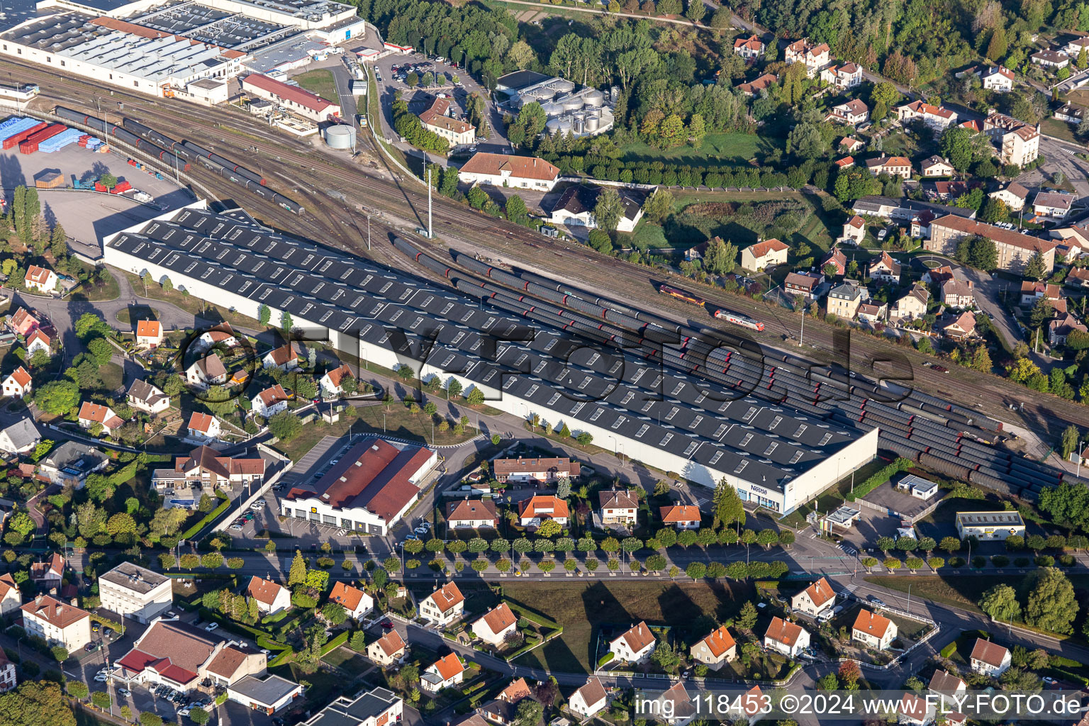 Aerial view of Buildings and production halls on the food manufacturer's premises Nestle Waters Supply Est in Vittel in Grand Est, France