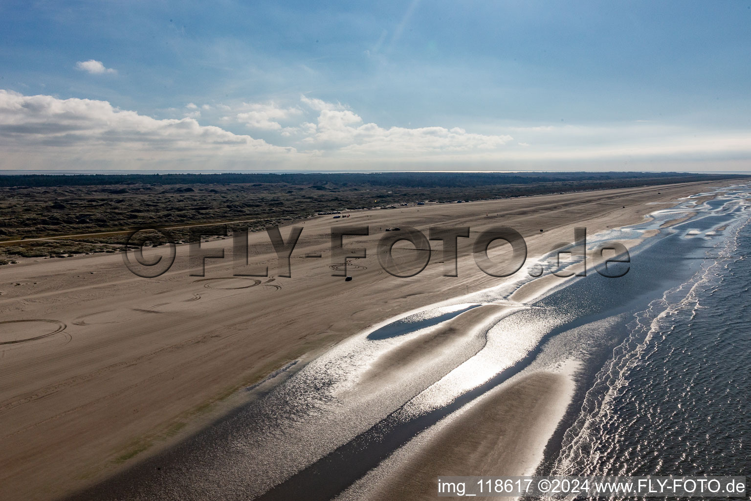 Cars riding on the Beach along the West coast of Northsea island in Fanoe in, Denmark