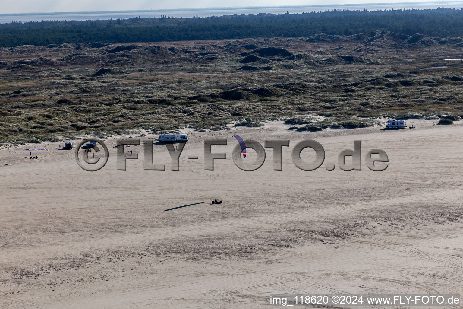 Aerial view of Buggies and kiters on the sandy beach in Fanø in the state South Denmark, Denmark