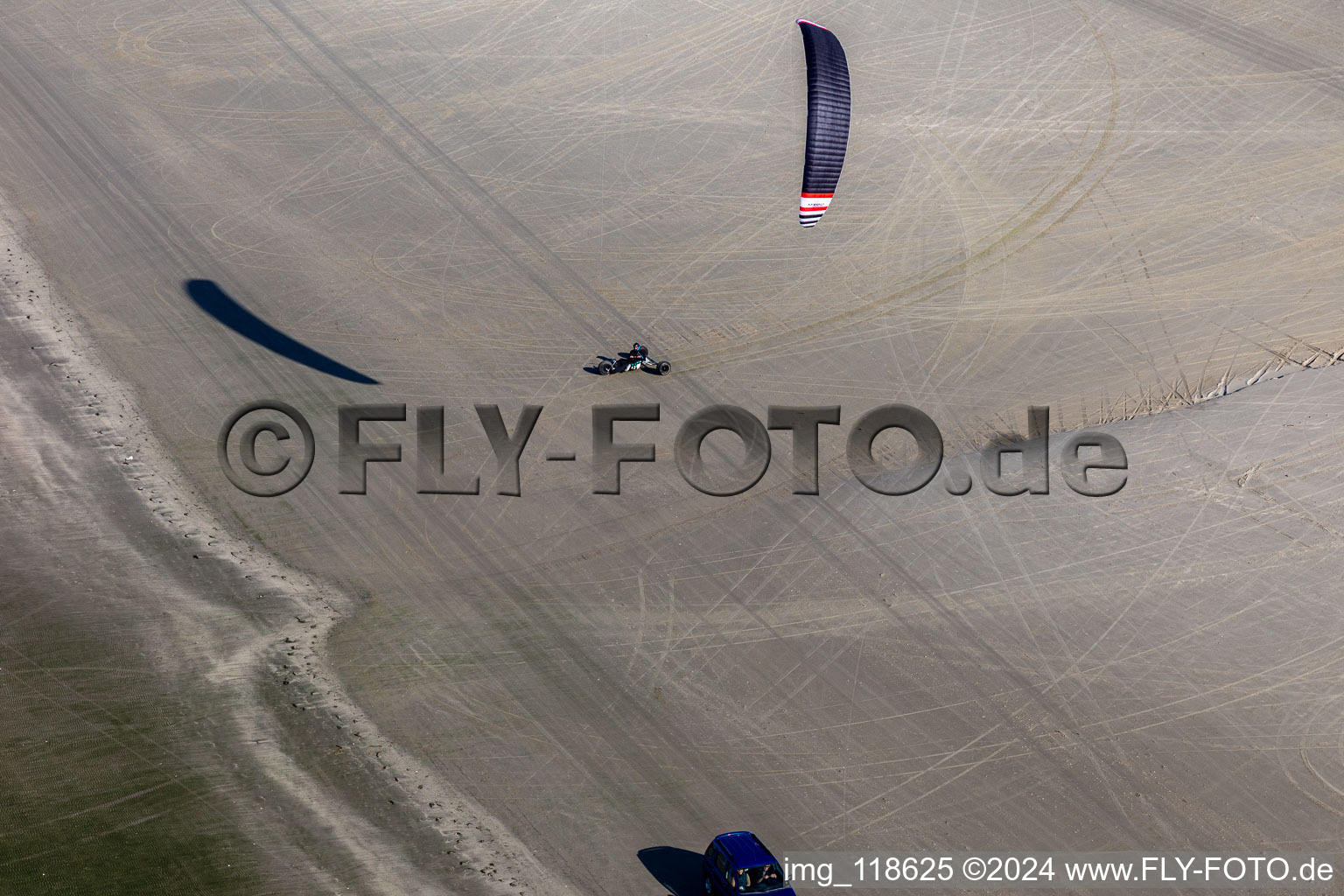 Oblique view of Buggies and kiters on the sandy beach in Fanø in the state South Denmark, Denmark