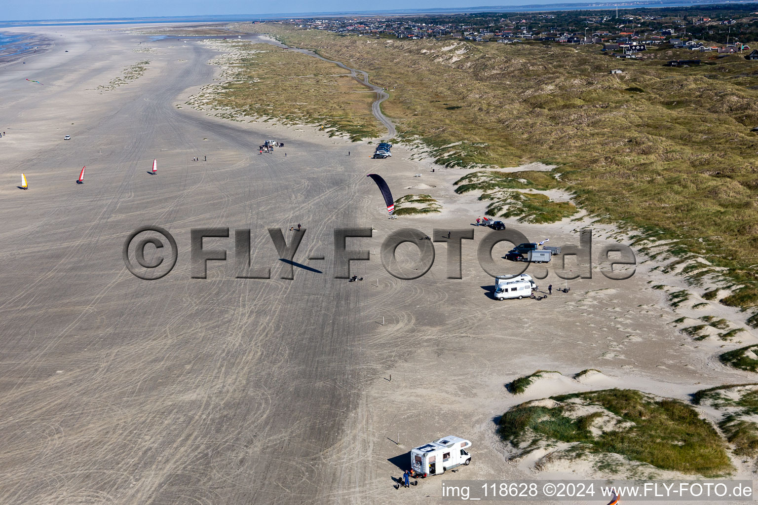 Buggies and kiters on the sandy beach in Fanø in the state South Denmark, Denmark from above