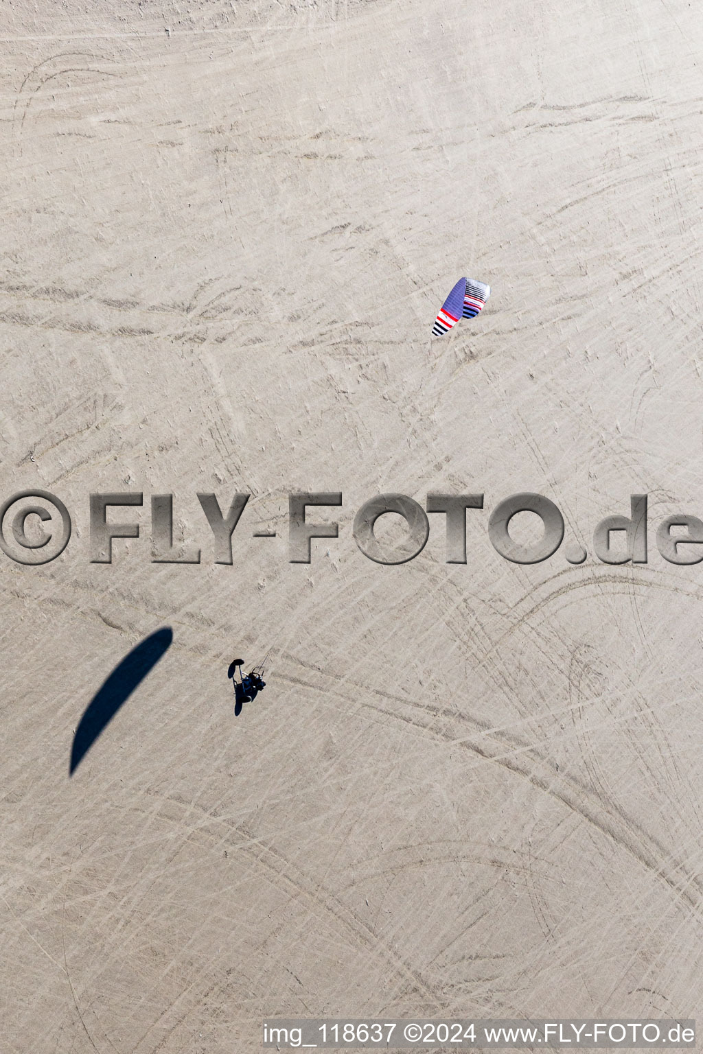 Bird's eye view of Buggies and kiters on the sandy beach in Fanø in the state South Denmark, Denmark