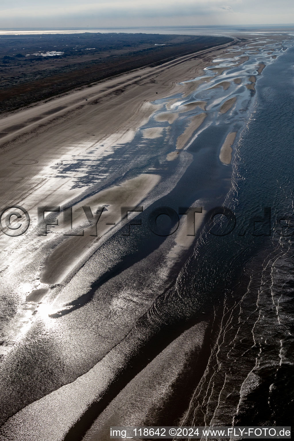 Aerial view of Cars riding on the Beach along the West coast of Northsea island in Fanoe in, Denmark