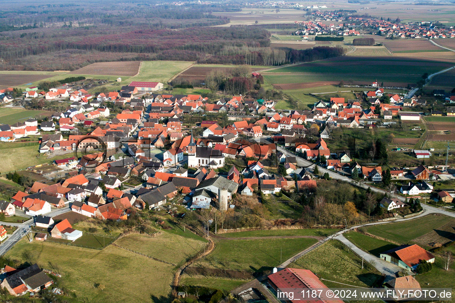 Village - view on the edge of agricultural fields and farmland in Salmbach in Grand Est, France