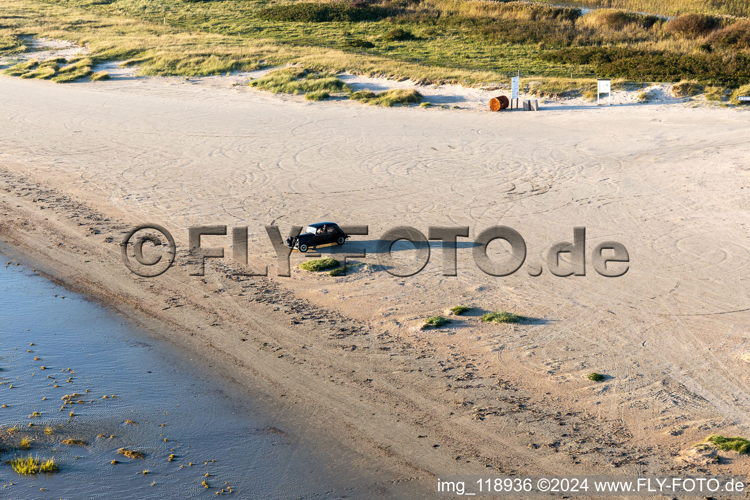 Beach landscape along the with Oldtimer vintage car Citroen auf Nordseeinsel in Fanoe in Syddanmark, Denmark