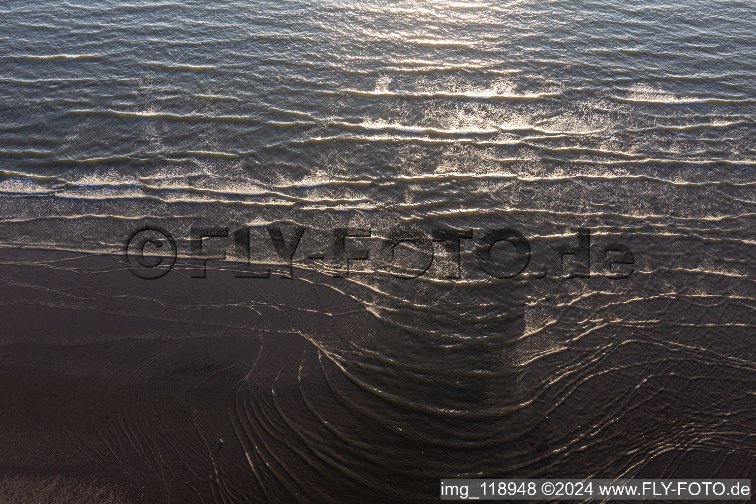 Beach landscape along the with waves in Fanoe in Region Syddanmark, Denmark