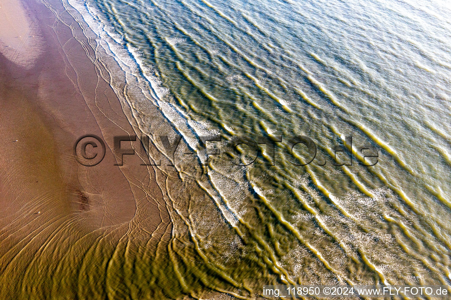 Aerial view of Beach landscape along the with waves in Fanoe in Region Syddanmark, Denmark