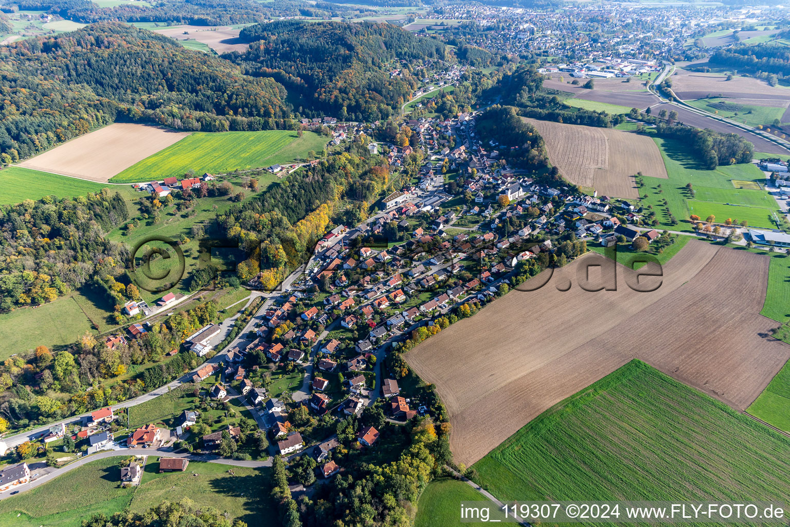 Aerial view of Agricultural land and field borders surround the settlement area of the village in Zizenhausen in the state Baden-Wurttemberg, Germany