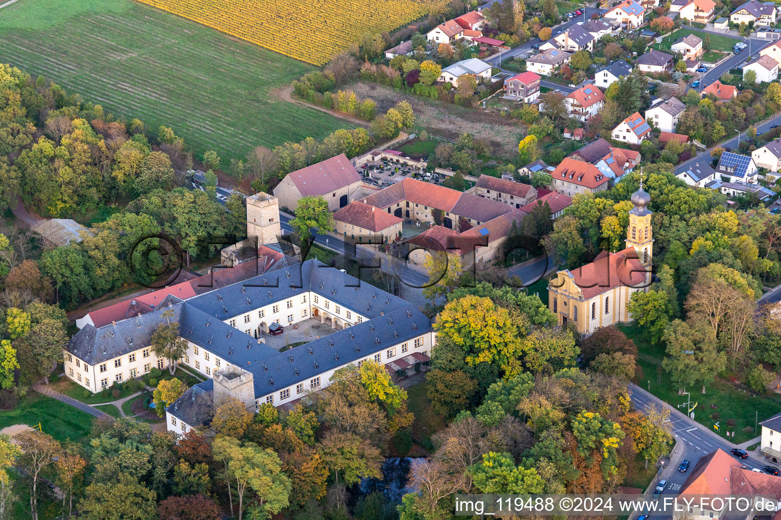 Palace Graeflich Schoenborna??sches Schloss Gaibach and Kirche to the Heiligsten Dreifaltigkeit in Volkach in the state Bavaria, Germany