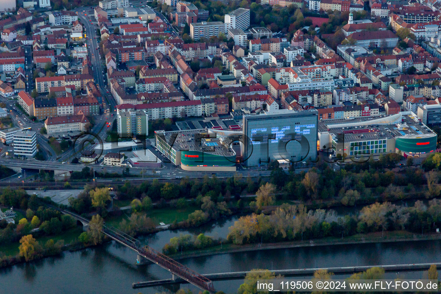 Building of the shopping center Stadtgalerie Schweinfurt and illumated SKF Hochhaus at dusk in Schweinfurt in the state Bavaria, Germany