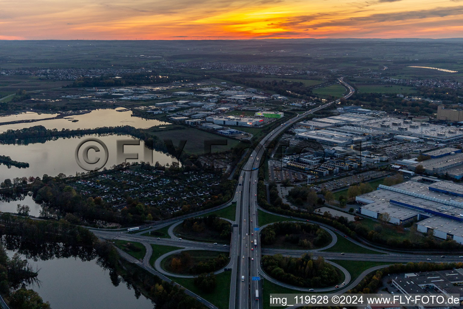 Sunset traffic flow at the intersection- motorway A 7 Exit Centre in Schweinfurt in the state Bavaria, Germany