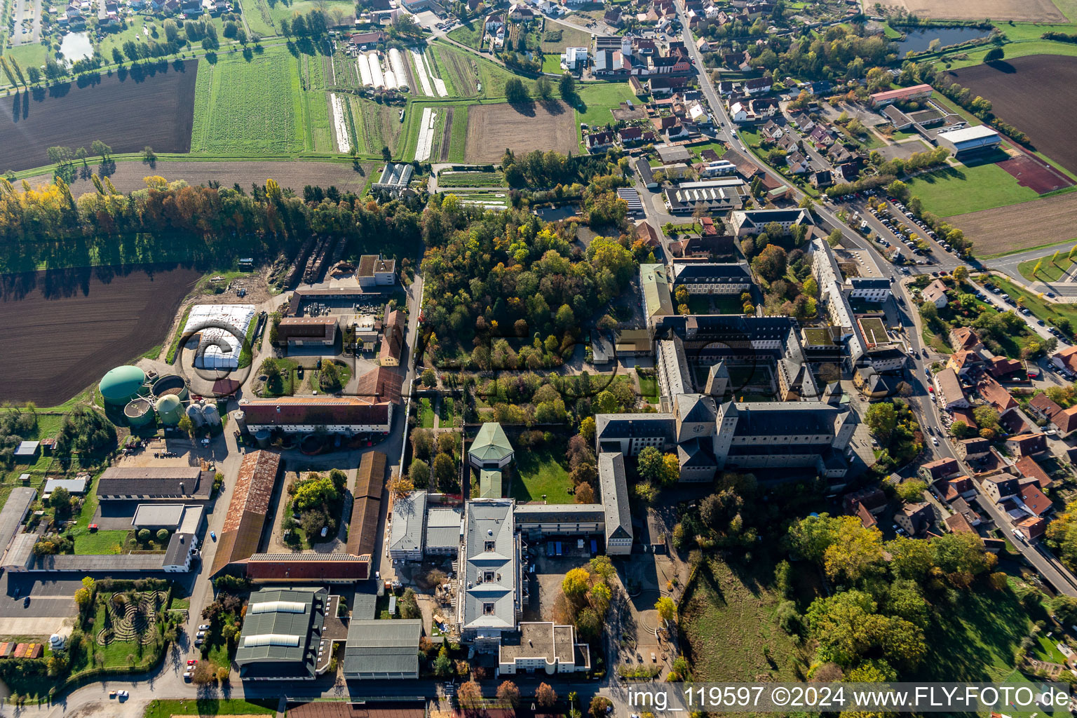 Oblique view of Complex of buildings of the monastery Abtei Muensterschwarzach in Schwarzach am Main in the state Bavaria, Germany