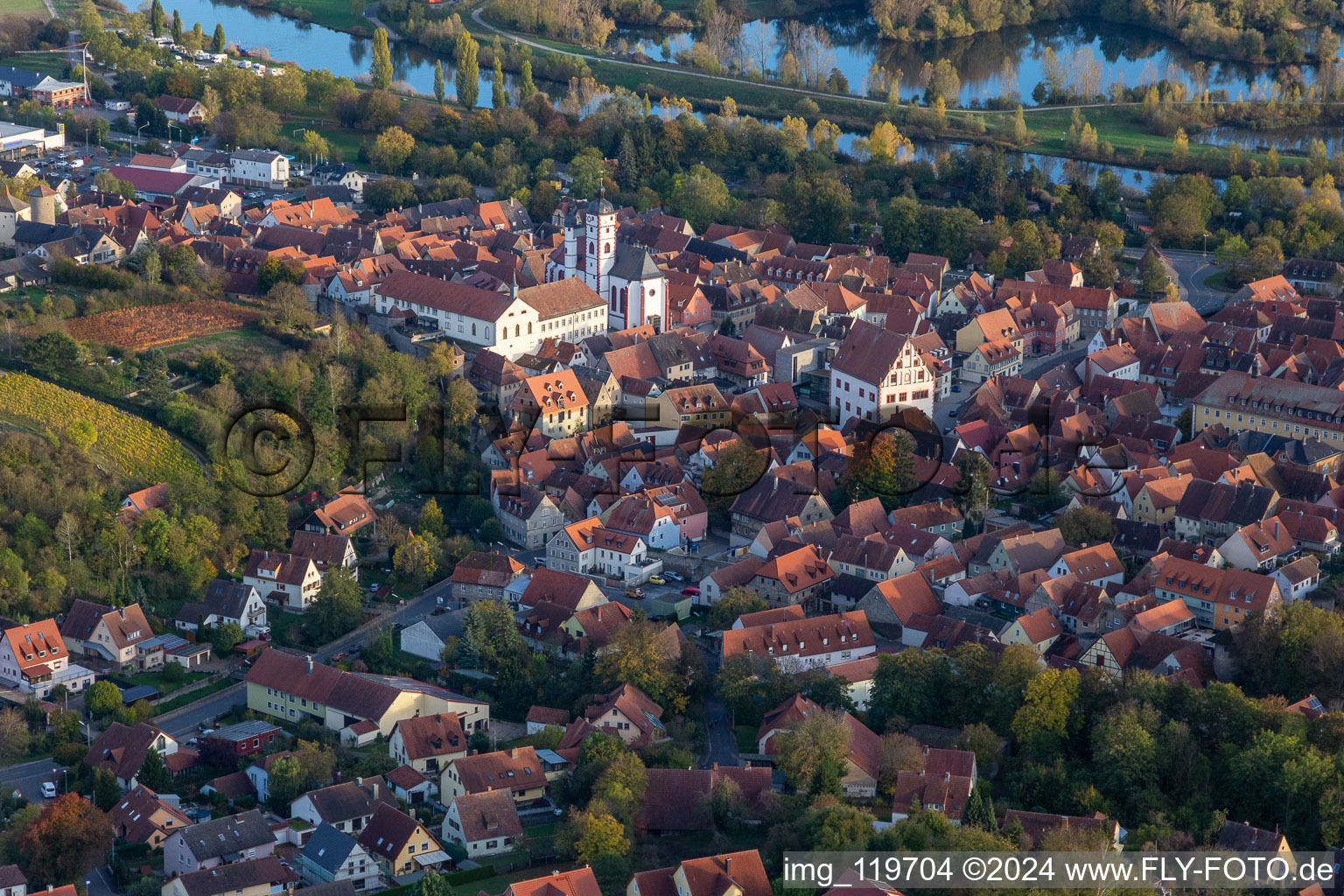 Aerial view of Town Hall building of the city administration on Rathausplatz and Pfarrkirche St. Augustinus in Dettelbach in the state Bavaria, Germany