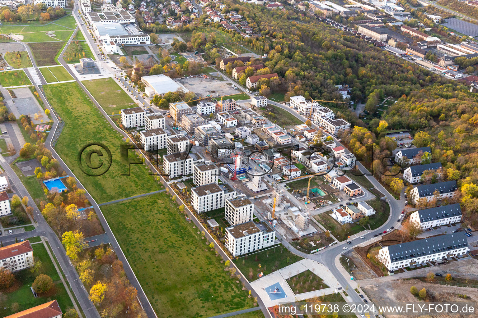 Residential construction site with multi-family housing development- on the along the Norbert-Glanzberg-strasse in Wuerzburg in the state Bavaria, Germany Two larger buildings were built by the construction community "Wuerzburg GbR" and planned for the companies "bogevischs buero architekten & stadtplaner GmbH" and "bauart Konstruktions GmbH + Co. KG", and more of the "INDUSTRIA WOHNEN GmbH" are to be built here