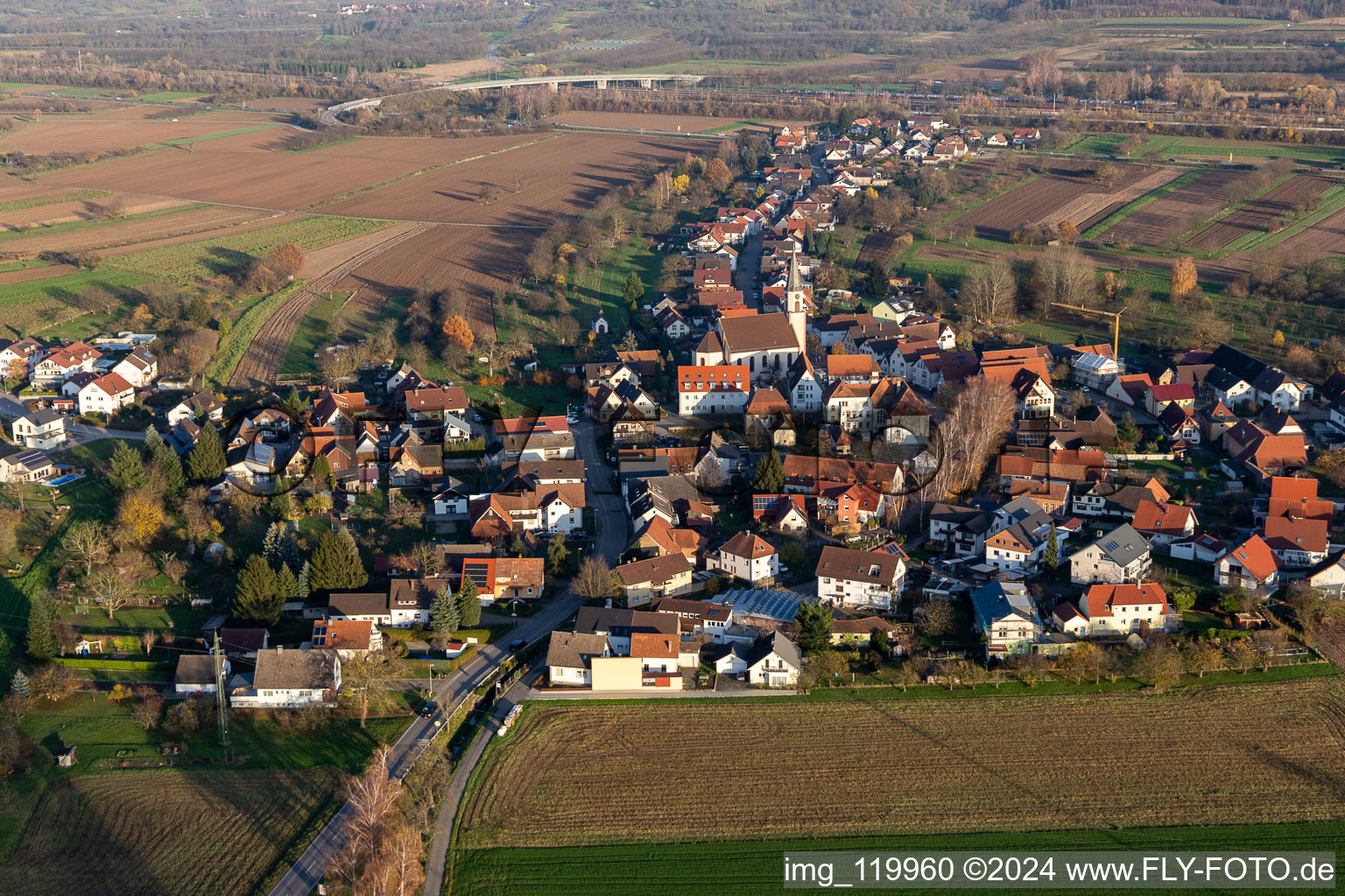 Oblique view of Agricultural land and field borders surround the settlement area of the village in Bohlsbach in the state Baden-Wurttemberg, Germany