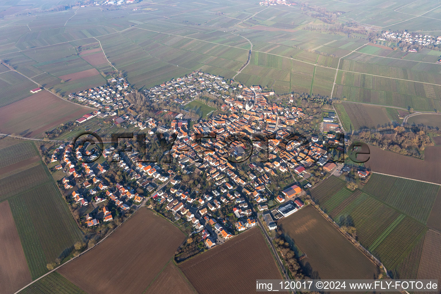 Drone image of Agricultural land and field borders surround the settlement area of the village in Moerzheim in the state Rhineland-Palatinate, Germany