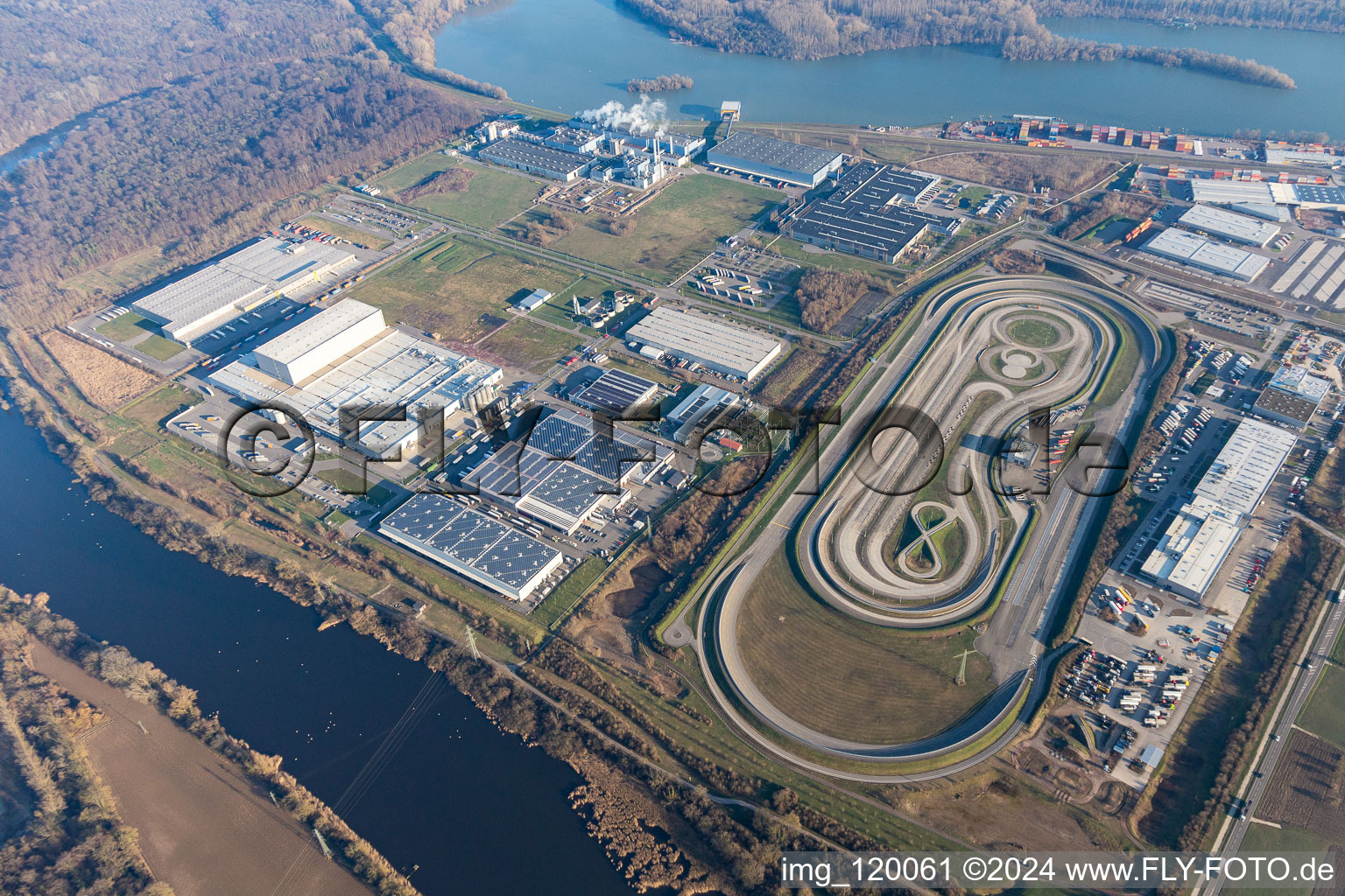 Test track for lorrys of Daimler with industrial estate of Europack GmbH, MEG GmbH, Netto, Papierfabrik Palm GmbH & Co. KG and NUSS-Unternehmensgruppe in Woerth am Rhein in the state Rhineland-Palatinate, Germany