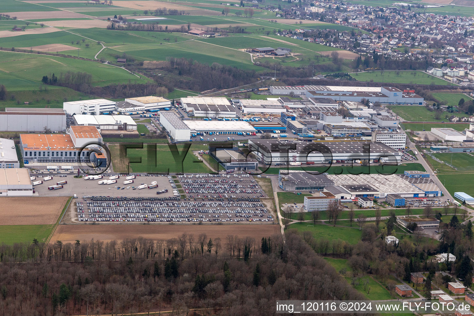 Aerial view of Technical facilities in the industrial area Riburg with Rodi Fructus, Kuehne + Nagel, DPD, Galliker Transport AG and Louis Ditzler AG in Moehlin in the canton Aargau, Switzerland