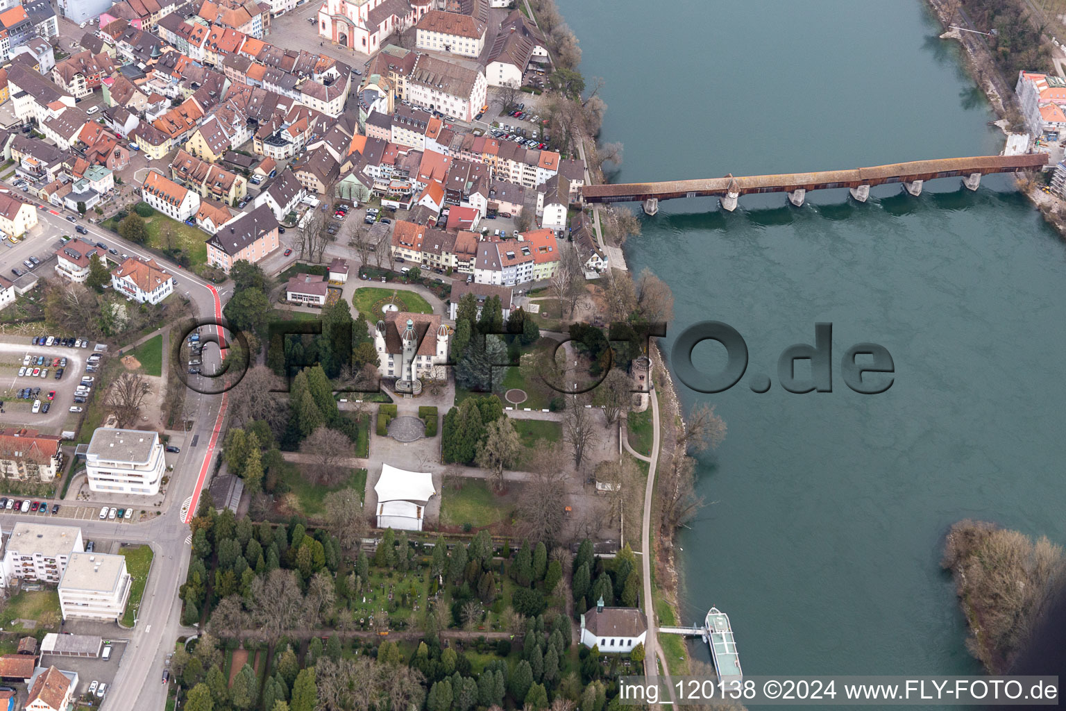 Aerial view of City center with old town and Castle Schoenau and the historic bridge to Switzerland crossing the river Rhine in Bad Saeckingen in the state Baden-Wurttemberg, Germany