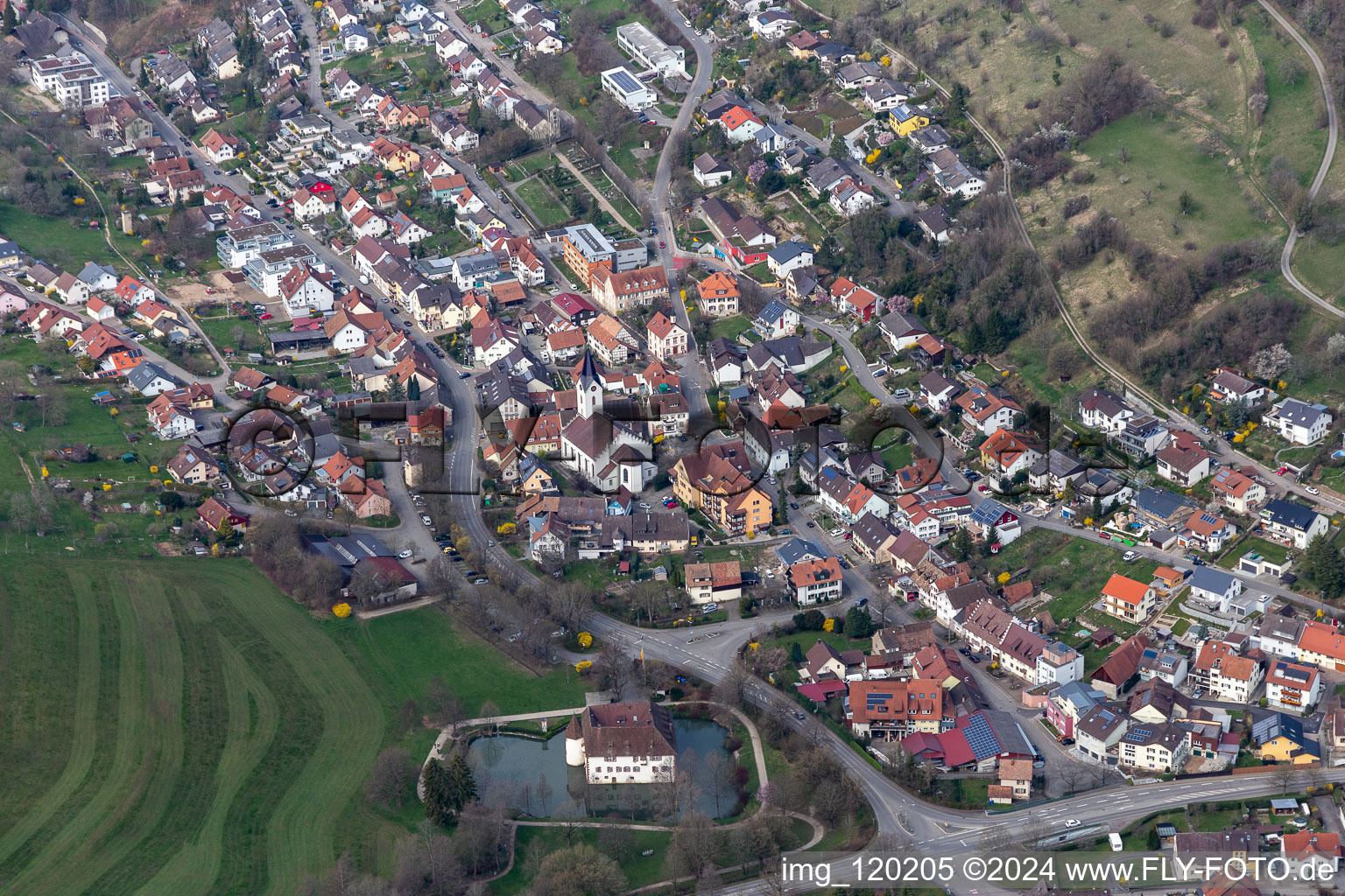 Town View of the streets and houses of the residential areas and Water-castle in Inzlingen in the state Baden-Wurttemberg, Germany