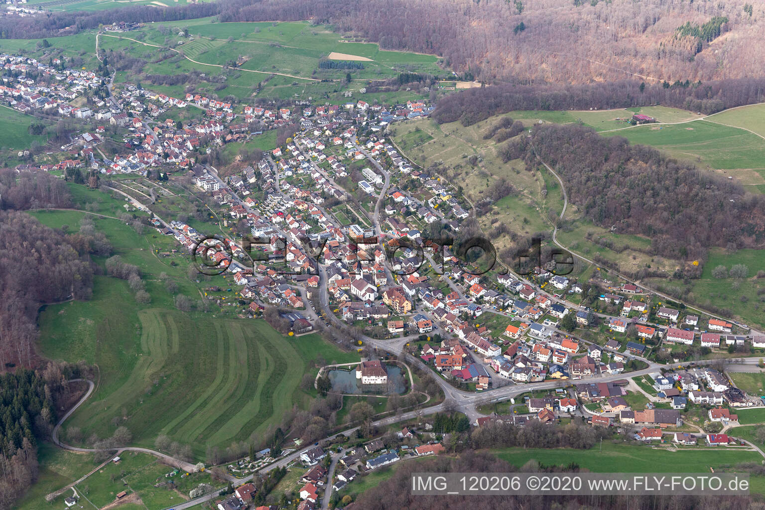 Aerial view of Town View of the streets and houses of the residential areas and Water-castle in Inzlingen in the state Baden-Wurttemberg, Germany