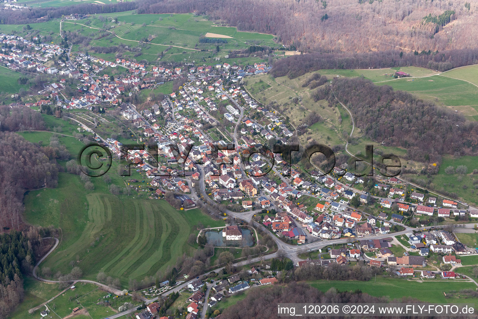 Aerial view of Town View of the streets and houses of the residential areas and Water-castle in Inzlingen in the state Baden-Wurttemberg, Germany