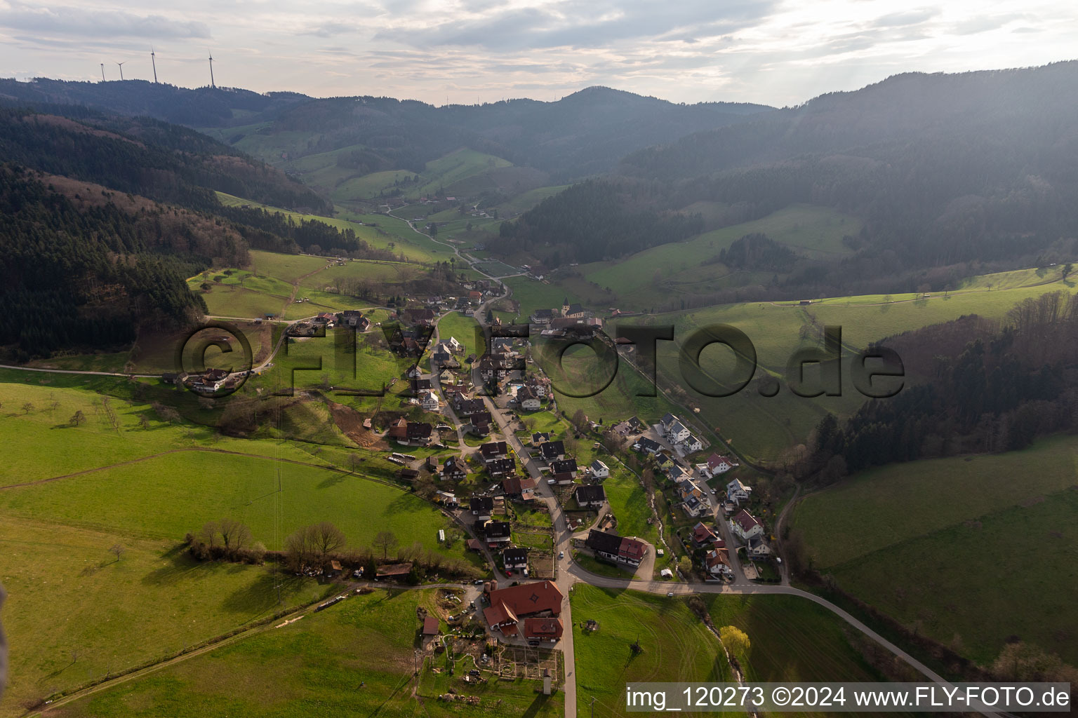 Location view of the streets and houses of residential areas in the valley landscape surrounded by mountains of the black forest in Prinzbach in the state Baden-Wuerttemberg, Germany