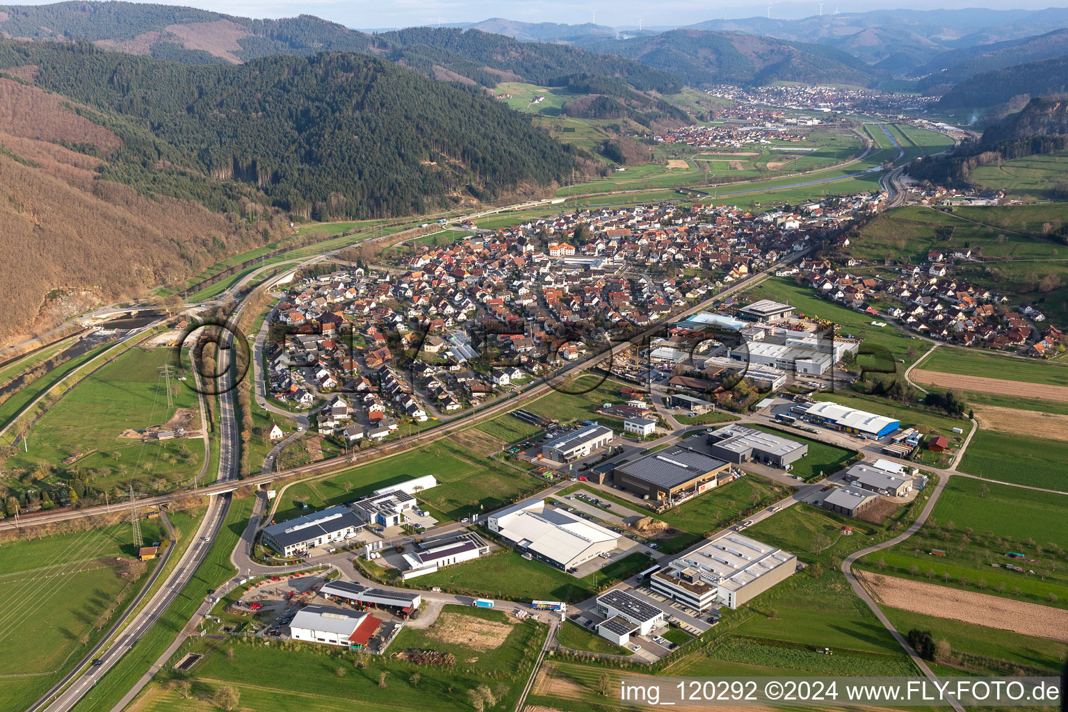 Location view of the streets and houses of residential areas in the valley of the Kinzig landscape surrounded by mountains in Steinach in the state Baden-Wuerttemberg, Germany