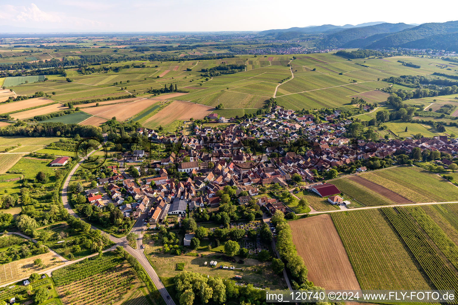 Drone recording of Agricultural land and field borders surround the settlement area of the village in Goecklingen in the state Rhineland-Palatinate, Germany