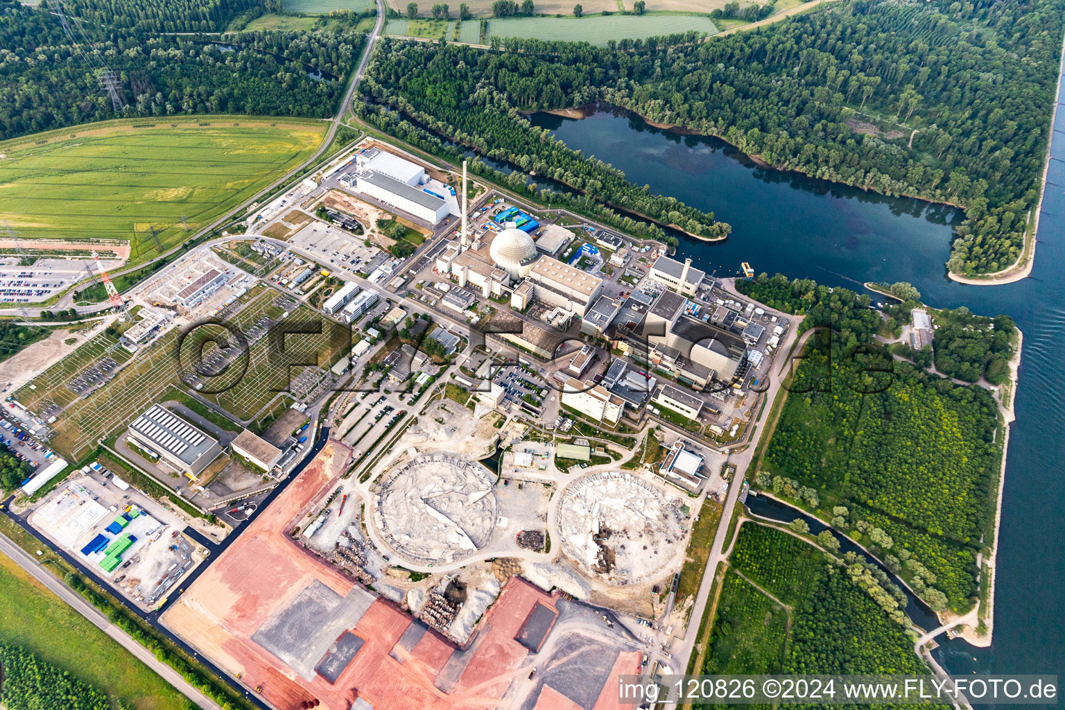 Oblique view of Remains of the decommissioned reactor blocks and facilities of the nuclear power plant - KKW Kernkraftwerk EnBW Kernkraft GmbH, Philippsburg nuclear power plant and rubble of the two cooling towers in Philippsburg in the state Baden-Wuerttemberg, Germany