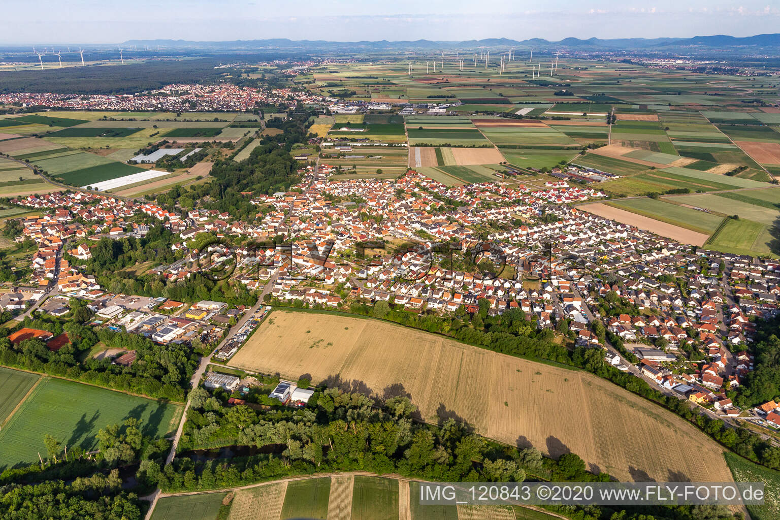 Aerial view of Village - view on the edge of agricultural fields and farmland in Hoerdt in the state Rhineland-Palatinate