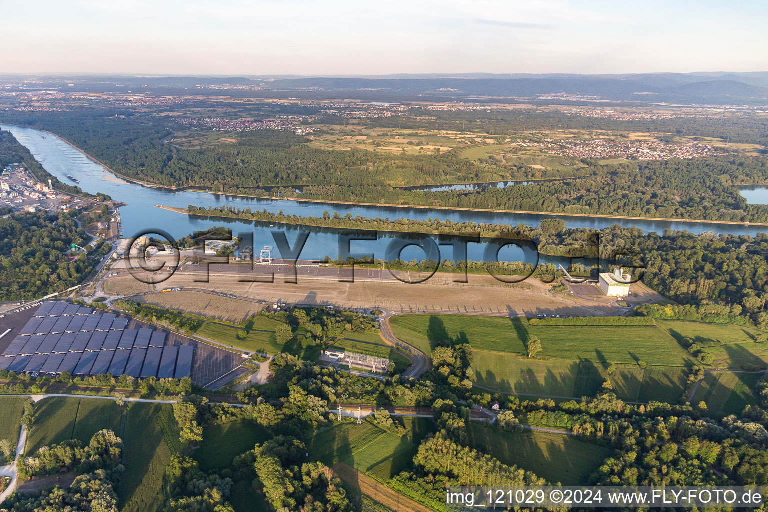 Aerial view of Wharves and piers with ship loading terminals in the new inner harbor at the Rhine river in Lauterbourg in Grand Est, France