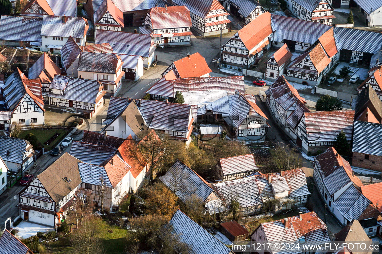 Wintery snow-covered half-timbered houses in the old town area in Hunspach in the state Bas-Rhin, France