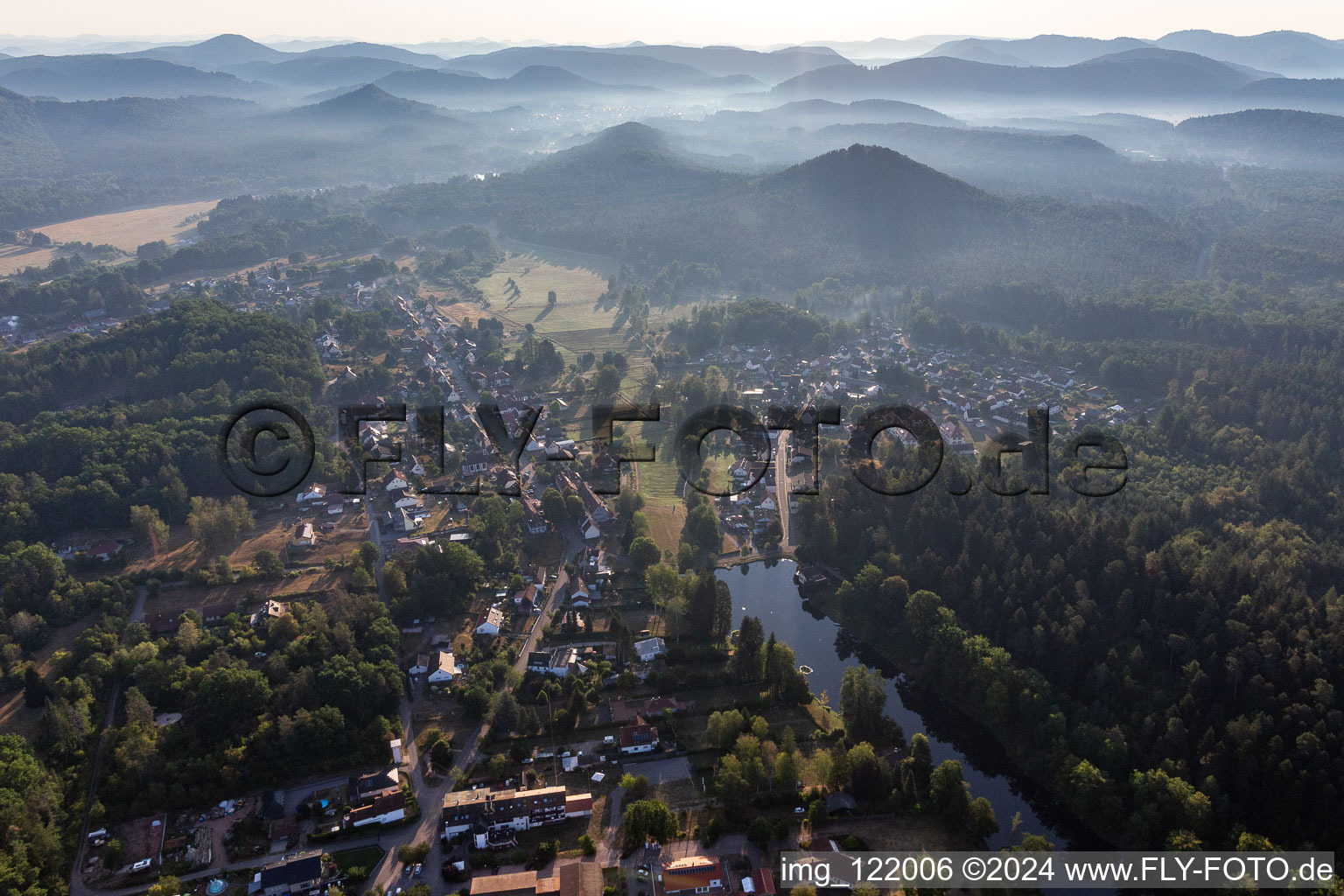 Surrounded by forest and forest areas center of the streets and houses and residential areas in Ludwigswinkel in the state Rhineland-Palatinate, Germany