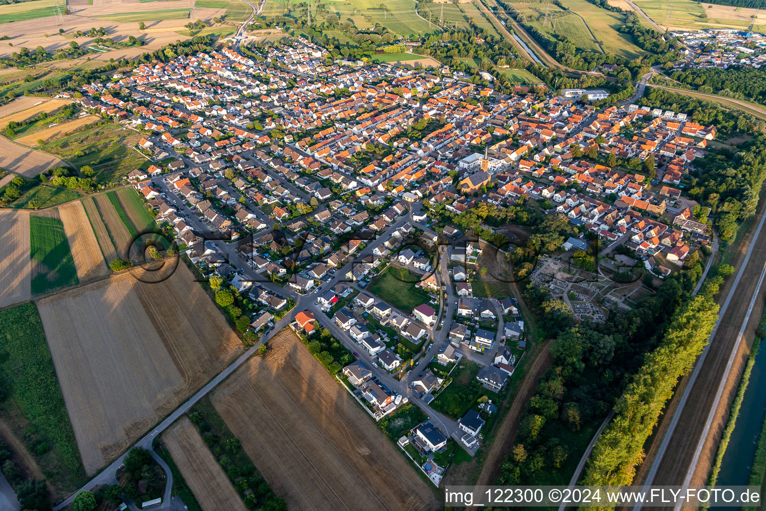 Village view on the edge of agricultural fields and land in Russheim in the state Baden-Wuerttemberg, Germany