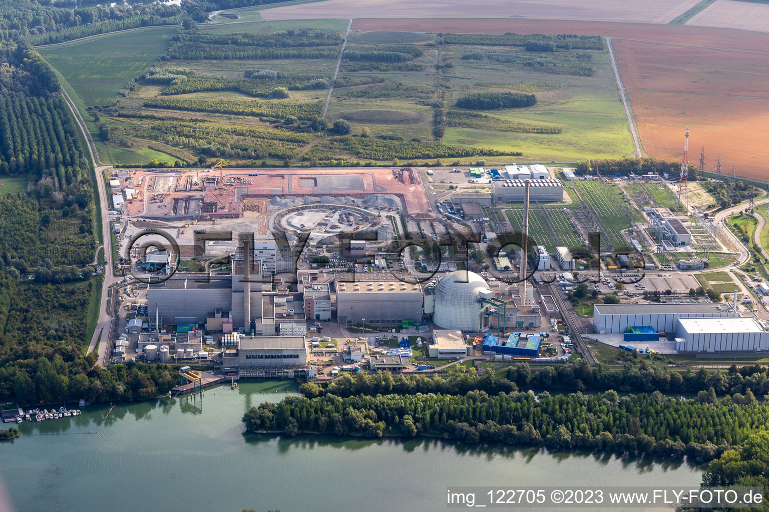 Aerial view of ENBW nuclear power plant under dismantling with construction site for the direct current converter in Philippsburg in the state Baden-Wuerttemberg, Germany