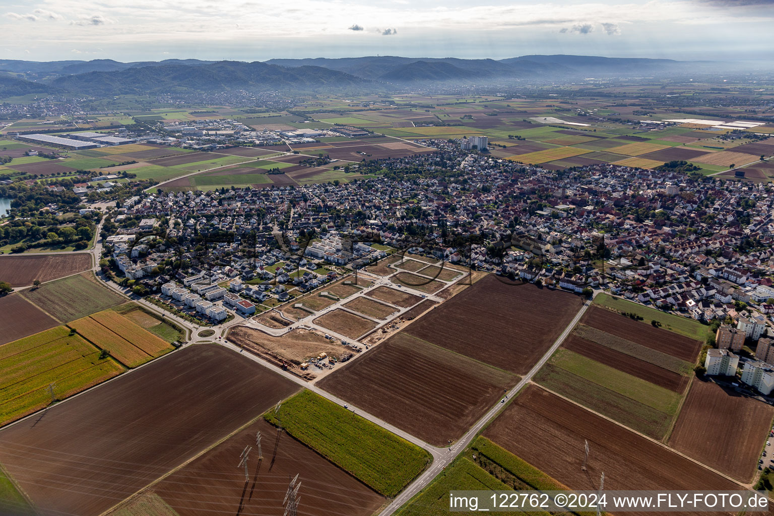 Location view of the streets and houses of residential areas in the valley of the Rhine surrounded by mountains of the Odenwald in Heddesheim in the state Baden-Wuerttemberg, Germanyjcoffee1