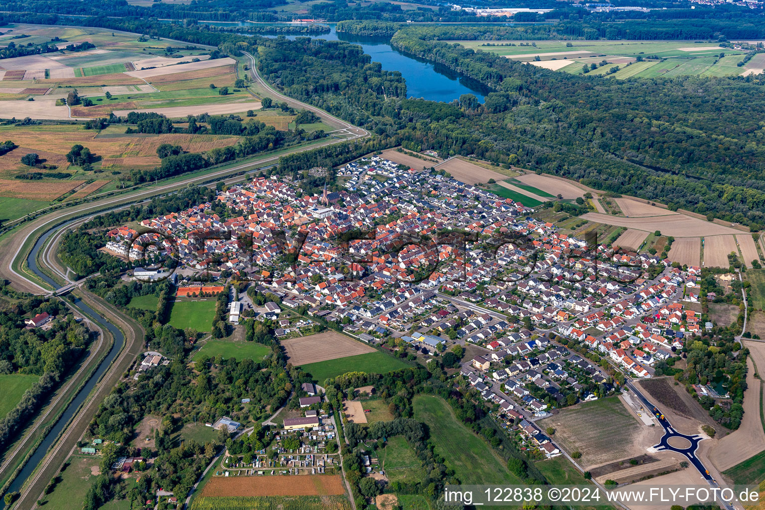 Aerial view of Village view on the edge of agricultural fields and land in Russheim in the state Baden-Wuerttemberg, Germany