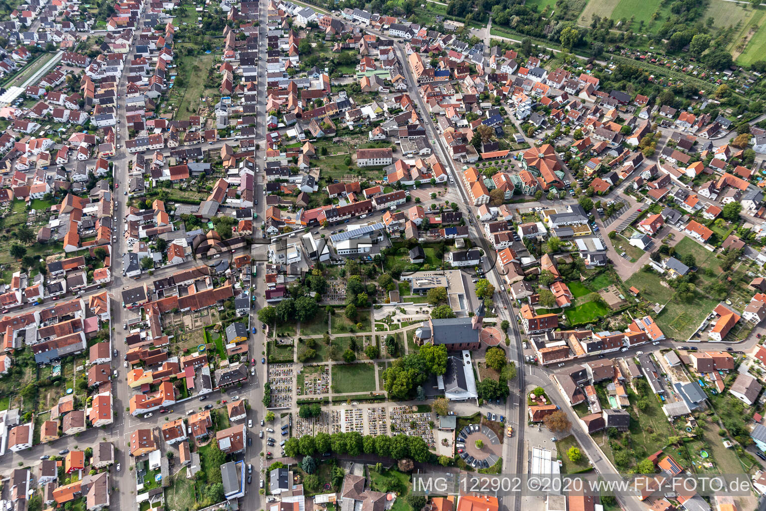 Aerial view of Grave rows on the grounds of the cemetery of Ev. Kirche Linkenheim in Linkenheim in the state Baden-Wuerttemberg, Germany