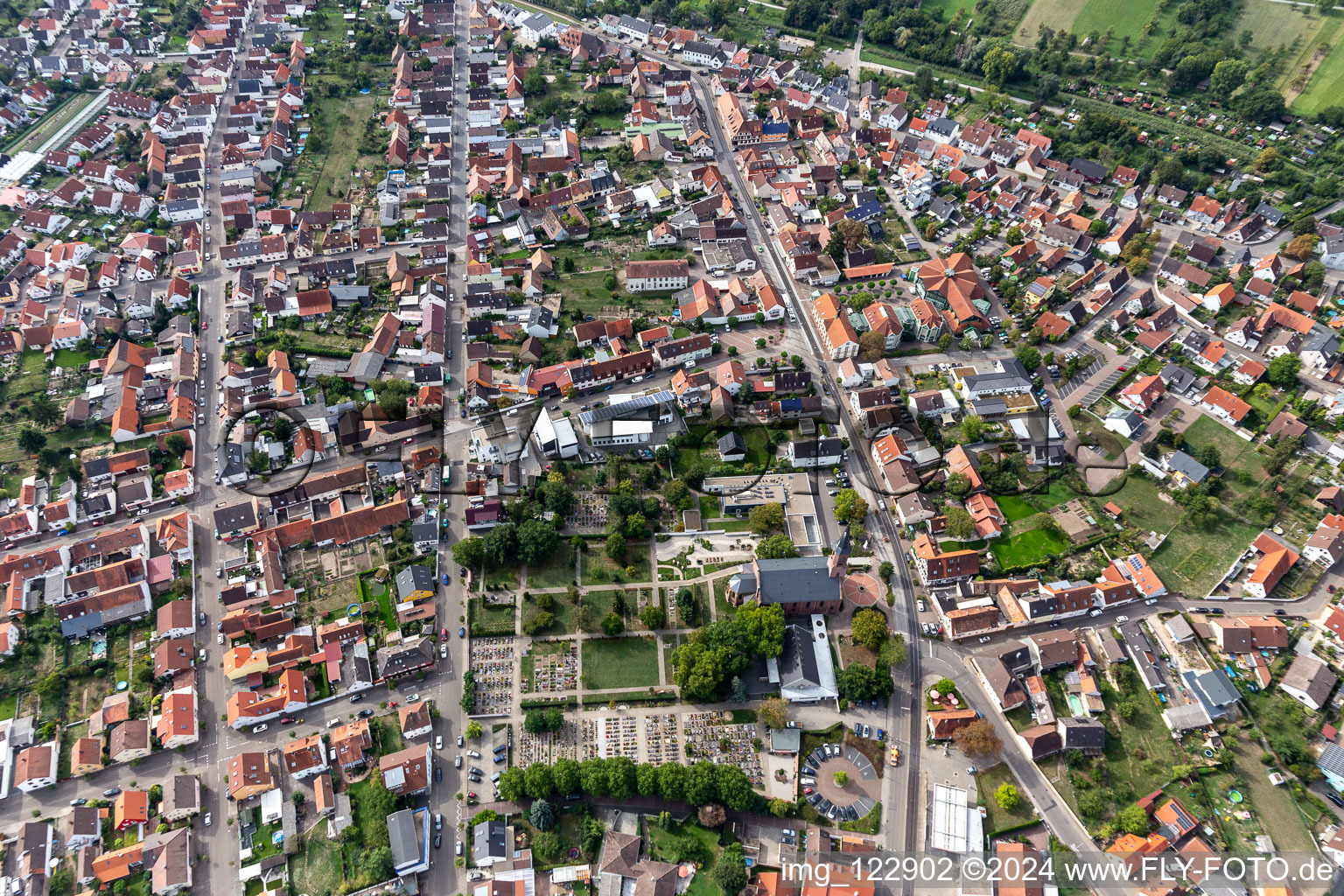 Aerial view of Grave rows on the grounds of the cemetery of Ev. Kirche Linkenheim in Linkenheim in the state Baden-Wuerttemberg, Germany