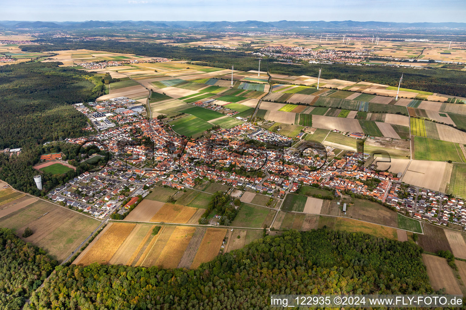 Aerial view of Village view on the edge of agricultural fields and land in Hatzenbuehl in the state Rhineland-Palatinate, Germany