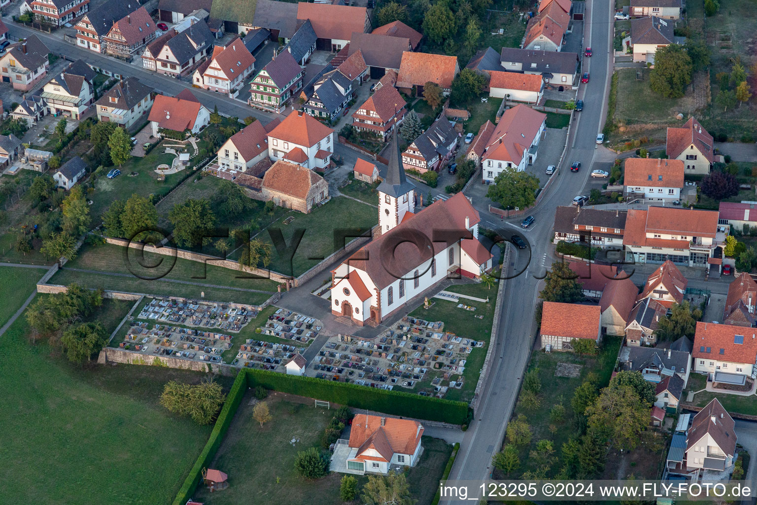 Grave rows on the grounds of the cemetery and catholic Church Saint-Martin in Seebach in Grand Est, France