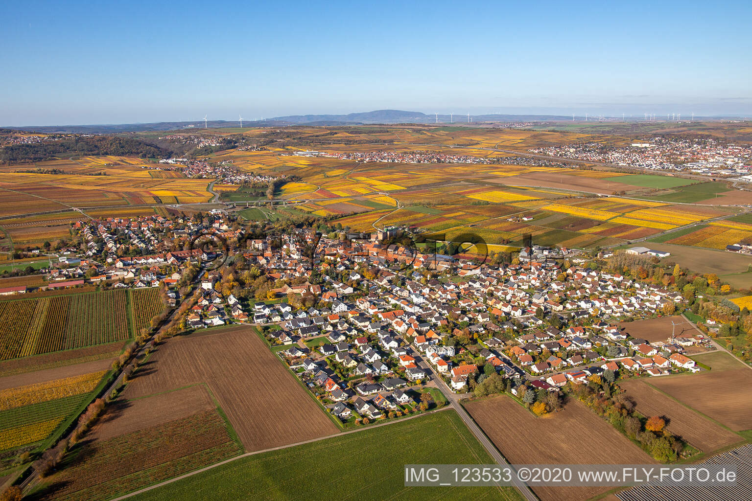 Aerial view of Autumnal discolored village view in Kirchheim an der Weinstrasse in the state Rhineland-Palatinate, Germany